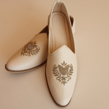 Ivory Cream Leather Jutti Mojaris with Gold Zardozi Crest Embroidery - SHOE03